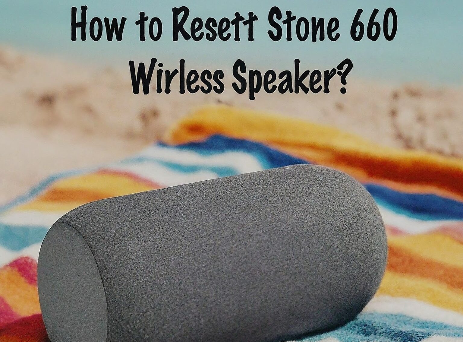 A photo of a gray Boat Stone 650 wireless speaker on a colorful beach towel. The text "How to reset BoAt Stone 650 Bluetooth wireless speaker?" is written above the speaker in a bold, blue font.