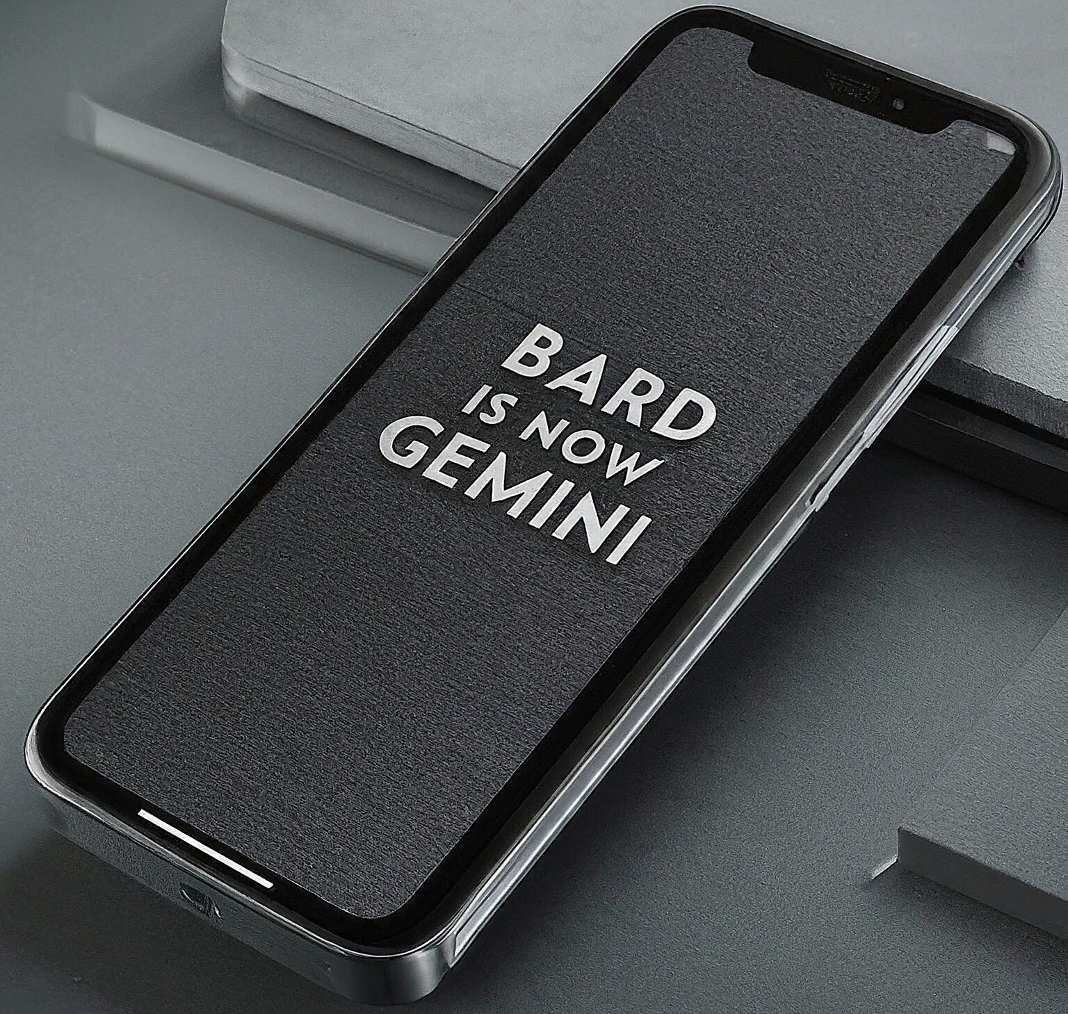Bard is now gemini is written on mobile phone screen with quesion what is bard google?